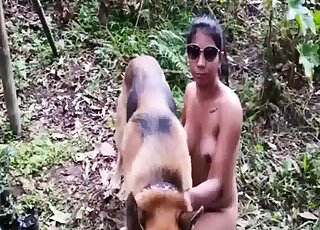 German Shepherd lets Latina lady do oral work on his shaft outdoors