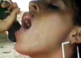 Skinny chick moans loudly while sucking massive shaft of a horse