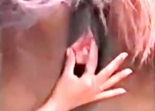 Naked bitch enjoys stuffing her fingers inside horse's wet pussy